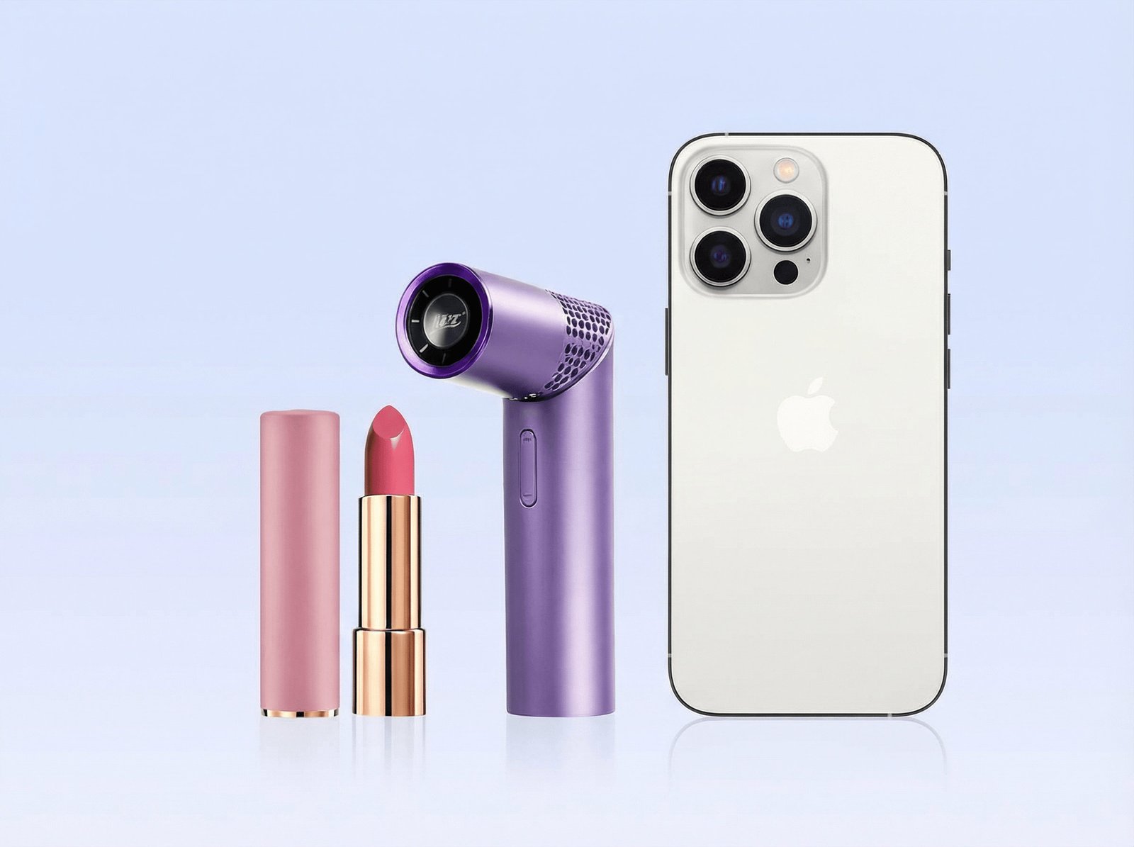 Mini fan shown beside a lipstick and a phone to prove compact size